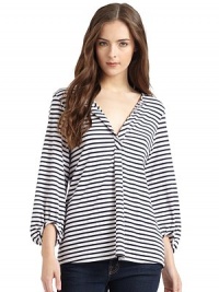 THE LOOKStriped designRound split neckline Long bishop sleevesBack yoke with gathered detailTHE FITAbout 28 from shoulder to hemTHE MATERIAL95% rayon/5% spandexCARE & ORIGINHand washMade in USA of imported fabricModel shown is 5'9½ (176cm) wearing US size Small. 