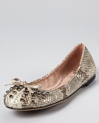 Sparkling rhinestones and serious studs make a statement-making combination on a classic pair of VINCE CAMUTO flats.