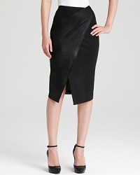 Make a modern statement in a sophisticated Donna Karan New York skirt teaming soft wool and supple leather panels in a pull-on silhouette for a flawless 24-hour look.