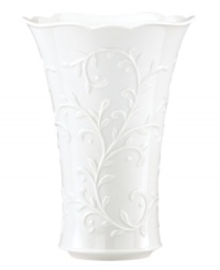 Featuring the embossed vine motif and shiny white glaze of the Opal Innocence Carved collection, this Lenox vase is designed to refine your home indefinitely. With a gently flared silhouette and scalloped edge. A beautiful wedding present!