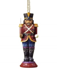 Standing guard at your tree, the Nutcracker soldier ornament is an instant holiday classic. Elaborate carved and patterned detail give him the traditional charm of Jim Shore.