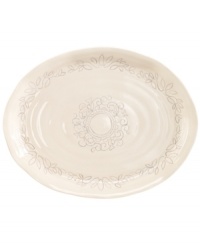 Homegrown style. An organic shape and engraved florals give the Espana Antica platter a handcrafted feel that suits country settings. From the Tabletops Unlimited dinnerware collection.