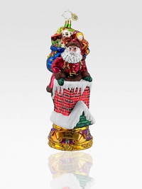 Inspired by the famous Christmas song, a fancily decorated Santa carefully makes his way down the chimney with a bag full of toys. Hand-blownHand-painted7½ highMade in Poland