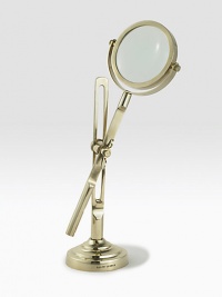 This fully functioning standing magnifier is crafted in a vintage-inspired silhouette from antiqued brass. 11½H X 4 diam.Brass and glassImported