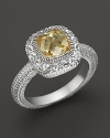 A sterling silver ring with cushion-cut canary crystal stone and white sapphire pave frame. By Judith Ripka.