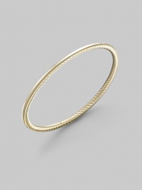 A unique bangle of 18k gold, polished on the outside with a twisted Yurman cable on the inside. 18k yellow gold Diameter, about 2½ Made in USA