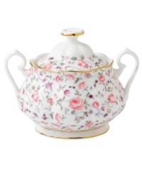 Scattered with dainty blooms, the Rose Confetti sugar bowl restores the grace and charm of another era in fine bone china from Royal Albert. Scalloped edges with gold banding and a traditionally feminine palette add to its romantic sensibility.