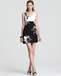 Featuring a chic black and white print, this Oonagh by Nanette Lepore dress is the perfect choice for your upcoming party--day-chic with cutouts at the sides and a slightly flared skirt for a hint of retro inspiration.