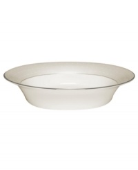 Dress up any veggies or sides with this fine china serving dish. From innovative designer Monique Lhullier, it features a pearlescent border with glossy raised dots and a fine stitch-like pattern.