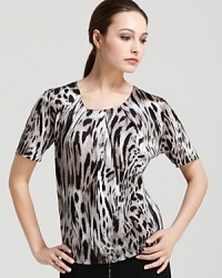 A vivid blaze of tiger print lends exotic movement to a Bloomingdale's Exclusive BASLER blouse. Slip the fluid style into a sleek pencil skirt for a polished approach to safari chic.