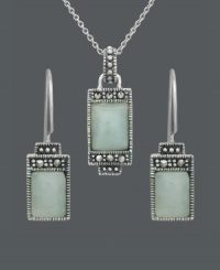 Express peace and tranquility in the form of pale, green hues. Cabochon jade stones (7 mm x 9 mm and 5 mm x 7 mm) make a serene statement when framed by the subtle glitter of marcasite. Genevieve & Grace set crafted in sterling silver. Approximate necklace length: 18 inches. Approximate pendant drop: 1 inch. Approximate earring drop: 1 inch.