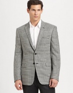 A smartly checked houndstooth pattern dresses up this impeccably tailored piece.Notched lapelButton frontFlap pocketsButton cuffsFully linedAbout 31 from shoulder to hem98% wool/2% lycraDry cleanImported