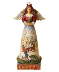 What a blessing, this Jim Shore angel figurine watches over you and your family with serene beauty. With a lit candle in-hand and warming winter scene in her skirt, she's heaven-sent for holiday homes.