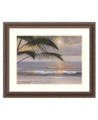 Experience paradise every day on the shores of this tropical beach. Beyond an outstretched palm tree, the rising sun illuminates a rippling sea and sailboats drifting toward the horizon. Finished with a rustic wood frame.