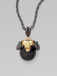 A goldplated and black rhodium plated sterling silver ram head, complete with pavé cubic zirconia, looms over a jet crystal, strung on a long elegant chain.Jet crystal Cubic zirconia Goldplated sterling silver Black rhodium plated sterling silver Chain length, about 30 Pendant width, about 1½ Lobster clasp Imported