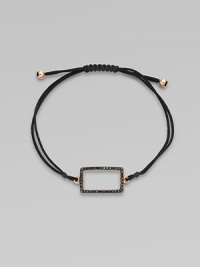 A knotted cord with a black diamond encrusted, 18K rose gold, rectangular link. Black diamonds, .28 tcw18K rose goldPolyester cordLink size, about ¾Length, about 13½ adjustableDrawstring closureImported 