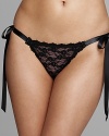 A sheer lace thong with pretty satin tie detail at hips.