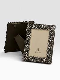 Swarovski crystals lend a twinkling effect to this oxidized platinum tone design. Holds 5 X 7 photoClassic beveled glassStretched leather backingGift boxedImported