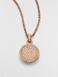 From the Brilliance Collection. A pretty pavé pendant has a slight concave shape that enhances the sparkle of its light-catching glass stones as it hangs from a graceful rose-finished chain.GlassRose goldtoneChain length, about 16Pendant diameter, about .5Clasp closeImported