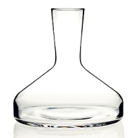 The perfectly formed, mouth-blown shape of Antonio Citterio and Toan Nguyen's Decanter was thoughtfully designed to enhance the qualities of its contents. The neck opens slightly, allowing wine to breathe and release the flavors and bouquet that have been locked inside it, while the clean, clear design lets in light to ignite the brilliant color of wine.