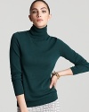 The ideal contrast to of-the-moment printed pants and colored denim, this C by Bloomingdale's turtleneck flaunts a classic silhouette in sumptuous cashmere for instant chic.