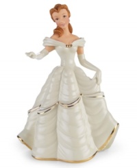 Belle looks radiant as ever in a shimmery dress in this beautiful figurine inspired by the Disney classic Beauty and the Beast. Accented with 24-karat gold and measures 8.