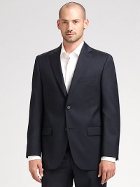 EXCLUSIVELY OURS. An essential look that travels as well as it wears, tailored in sophisticated wool super 120s that never goes out of style. Two-button closure Chest welt, waist flap pockets About 30¼ from shoulder to hem Loro Piana serge wool; dry clean Imported Additional Information Men's Suits Size Guide 