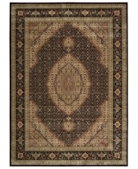 Distinctive flair with roots in Persian design. This exquisitely ornate area rug is abound in deep, striking black and beige tones, highlighted by a dramatic central medallion, and crafted from Nourison's own Opulon™ yarns for a densely woven pile with long-lasting color retention and durability.