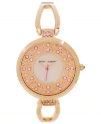 You'll be pretty in pink with this rosy watch from Betsey Johnson. The beautiful bangle bracelet is adorned with glistening crystal accents for a spellbinding finish.