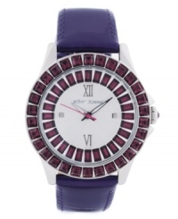 Dark crystal. Richly colored watch from Betsey Johnson crafted of purple leather strap and round polished stainless steel case. Bezel embellished with crystal accents. Silver tone textured dial features ring of baguette-cut crystal accents, gold tone Roman numerals at twelve and six o'clock, dot markers at three and six o'clock, gold tone hour and minute hands, signature fuchsia second hand and logo at twelve o'clock. Quartz movement. Water resistant to 30 meters. Two-year limited warranty.