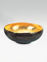 From the Sona Collection. A modern take on an ancient offering bowl, this glowing, gold-lined design has a simple, modern shape but the fascinating feel of an artifact unearthed long ago.Solid bronze with an oxidized finishGold interiorHand-finished12 diameter X 4.75HHand washImported