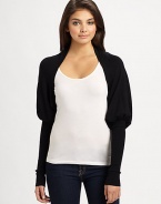 A chic, structured mutton sleeve lends unique style to this lightweight knit shrug.Open frontMutton sleeves with extra long cuffsAbout 10 from shoulder to hem80% rayon/20% nylonDry cleanImported