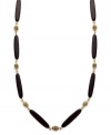 Add instant appeal to any outfit with this chic necklace from Lauren by Ralph Lauren. Featuring glass and resin onyx beads and an easy lobster claw clasp. Textured antique 14k gold plated beads provide the perfect finishing touches. Approximate length: 36 inches.