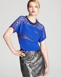 Lace and silk meet on this Nanette Lepore top for a new-season take on femininity that flaunts modern edge.