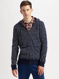 Nautical inspirations overtake a traditional zip-up hoodie, offering a sporty, yet sophisticated finish.Zip frontAttached drawstring hoodKangaroo pocketsBanded cuffs and hemCottonDry cleanImported