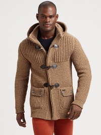 Made in Florence from the finest tweed yarn, this extra-chunky knit sweater has a removable hood and horn toggles, so it can double as a coat.Button-frontAttached hoodWaist flap pocketsRibbed knit cuffs and hemAbout 29 from shoulder to hem80% wool/20% nylonHand washMade in Italy