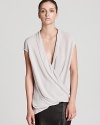 Master the elegance of draping in this Helmut Lang top with a low, crossover neckline and asymmetric hem. Slip into softness and refresh your look with luxury.