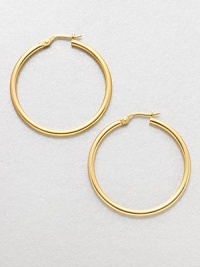 A simply classic, yet relevant design in radiant 18k gold. 18k goldLength, about 1.4Hinged post backMade in Italy