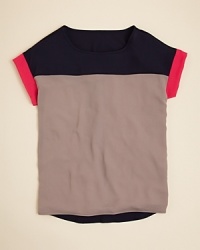 A lightweight layer to complement a sleek skirt or skinny jean, this colorblock top keeps it cool with pops of contrast colors.