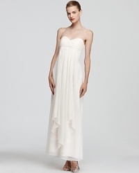 A vision in warm winter white, Laundry by Shelli Segal's strapless dress feels feminine with an empire waist and pretty pleating.