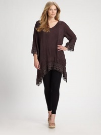 You will not want to take off this flowing, flattering tunic featuring exquisite embroidered details. V-necklineLong sleevesDropped shouldersEmbroidered trimHi-lo hemAbout 35 from shoulder to hemRayonMachine washImported