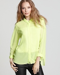 Borrowing from the colorful neon days of the eighties, this vibrant PJK Patterson J. Kincaid top is slightly sheet with oversized front patches and an edgy asymmetric hem--just add denim.