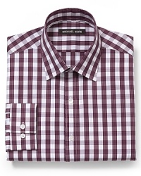 The always potent gingham check pattern gets a boost from Michael Kors in this swank dress shirt, featuring a comfortable fit and crisp cotton.