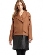 THE LOOKNotch lapelConcealed front snap closureLong sleevesFront flap pocketsExtended leather hemTHE FITAbout 36 from shoulder to hemTHE MATERIAL80% wool/20% nylonTrim: LeatherFully linedCARE & ORIGINDry clean by leather specialistImported