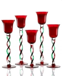 A festive twist. Combining vibrant red and green glass, these Winterberry candle holders from Pfaltzgraff make a merry impression in any holiday home.