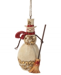 A classic snowman, complete with a carrot nose and two eyes made out of (what looks like) coal, this charming Jim Shore ornament will stay cool season after season.