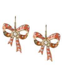 Wrap up adorable style with these too-cute bow earrings from Betsey Johnson. This pretty-in-pink design features gold-plating, eye-catching crystals accents and pretty glass pearls at center. An ear wire closure finishes the look. Approximate drop: 1-2/5 inch.