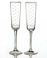 Dotted with hearts, Sweethearts toasting flutes are simultaneously classic and cute in clear glass. A special gift to give and to get from Martha Stewart Collection.