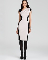 Dramatic color blocked details enhance and create a dramatic hourglass silhouette with this jersey knit French Connection dress.