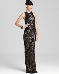 A high neck and racer back lends a fresh, modern look on David Meister's sequin-encrusted gown.